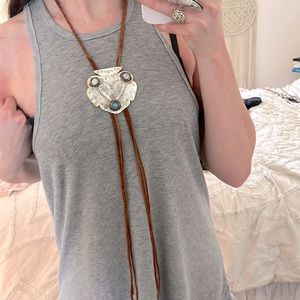 Free People bolo necklace.  Brown suede, braided around the neck.